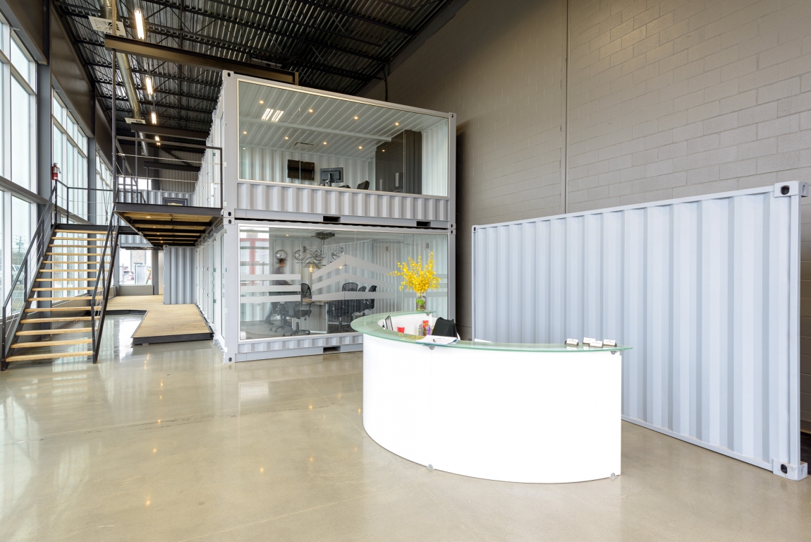 Minimalist industrial style office with container design