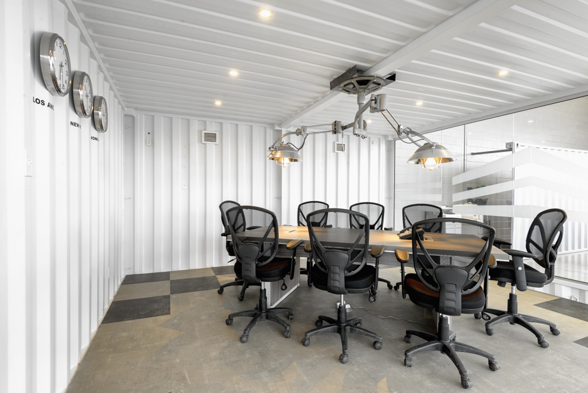 Minimalist industrial style office with container design