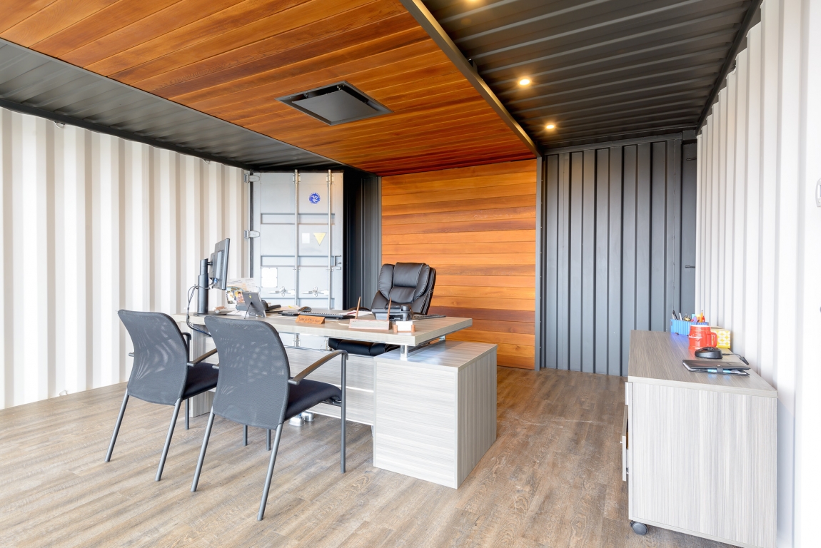 Minimalist industrial style office with container design