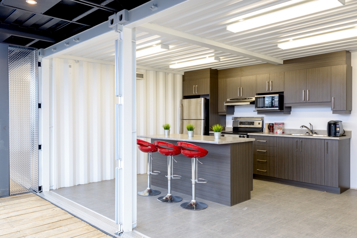 Minimalist industrial style office with container design